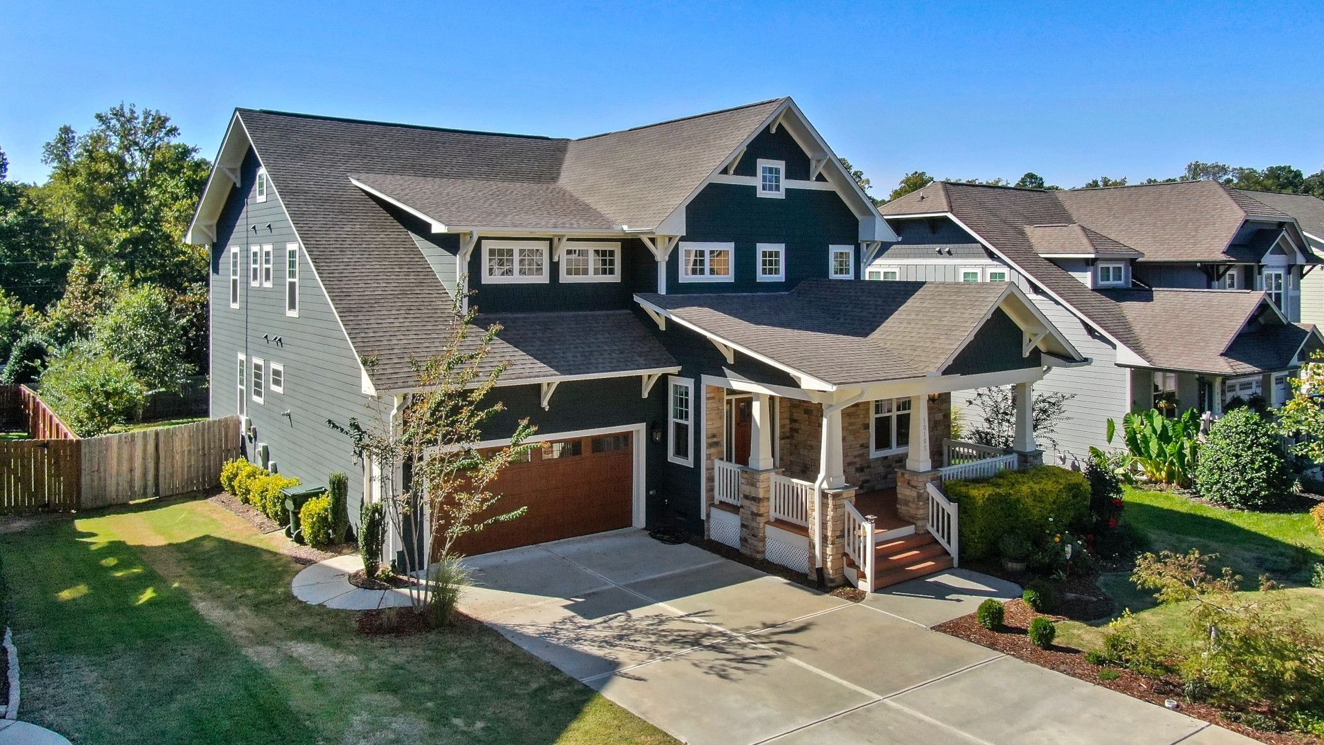 Aerial view of a freshly repainted craftsman home in Maine