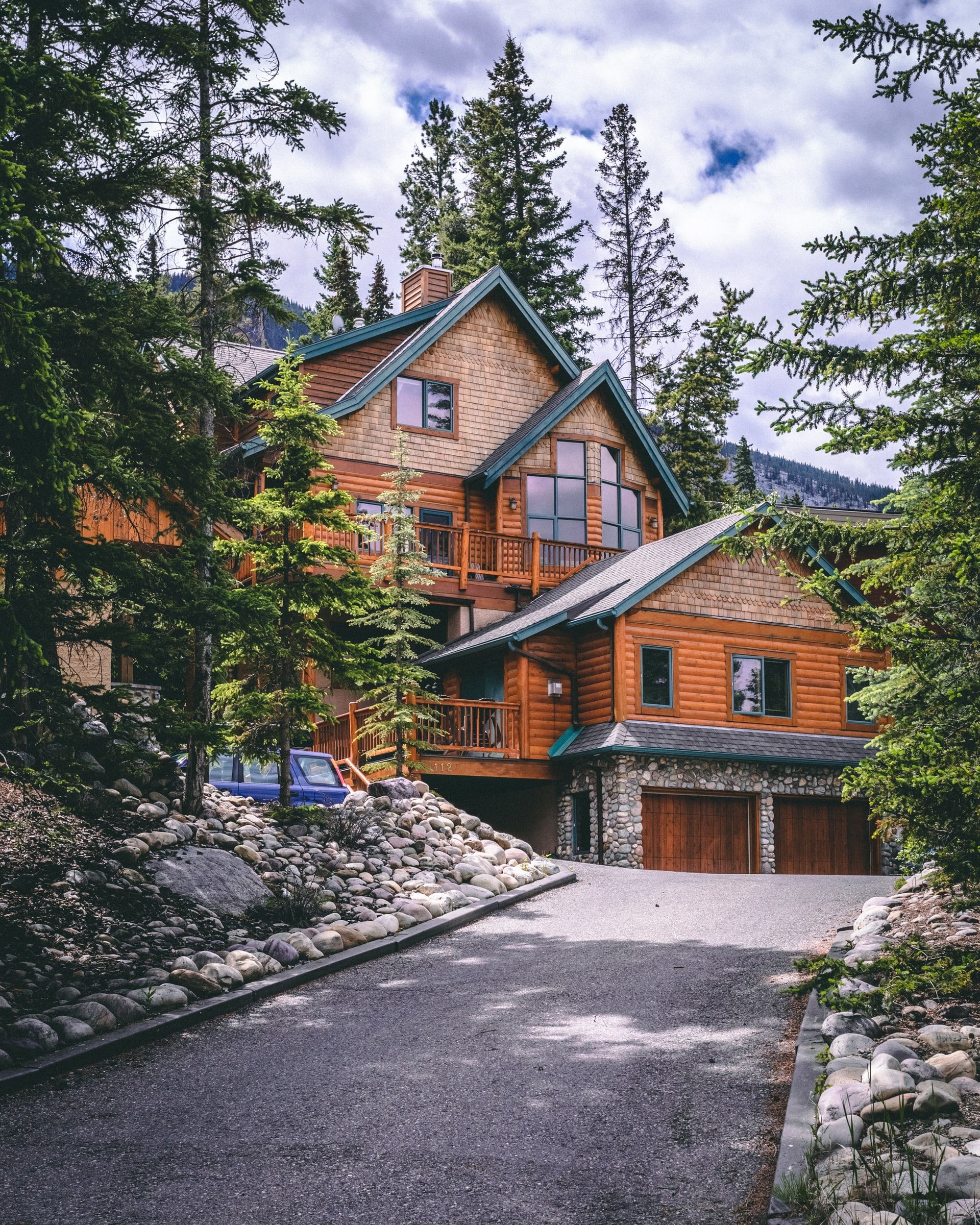 An outside driveway view of a painted house exterior